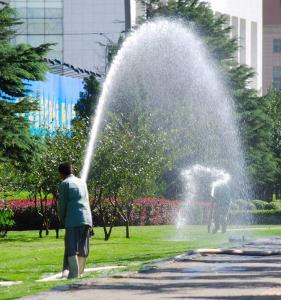 two of our Issaquah sprinkler repair are working on a commercial irrigation system